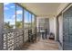 Comfortable balcony with a table and chairs, perfect for enjoying the outdoors at 9150 E Center Ave # 7C, Denver, CO 80247