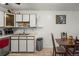 Kitchen with a dining area and a view of an art piece at 9150 E Center Ave # 7C, Denver, CO 80247