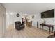 Open concept living room with a TV, dining area, and a view of the kitchen at 9150 E Center Ave # 7C, Denver, CO 80247