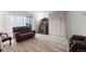 Inviting living room with hardwood floors and a comfortable brown leather sofa at 9150 E Center Ave # 7C, Denver, CO 80247