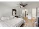 Comfortable primary bedroom featuring a neutral palette and adjoining bathroom and closet at 9150 E Center Ave # 7C, Denver, CO 80247
