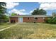 Spacious backyard featuring a grassy area, patio, and mature landscaping at 396 S Troy St, Aurora, CO 80012