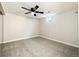 Finished basement with carpeted floors, a window, and a ceiling fan at 396 S Troy St, Aurora, CO 80012