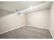 Finished basement with carpeted floors and a window at 396 S Troy St, Aurora, CO 80012
