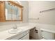 Classic bathroom with white tile, vanity, mirror and ample space at 396 S Troy St, Aurora, CO 80012