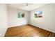 Bright bedroom with hardwood floors and large windows provide natural light at 396 S Troy St, Aurora, CO 80012