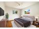 Bedroom with hardwood floors, a large window, and neutral walls to make you feel at home at 396 S Troy St, Aurora, CO 80012
