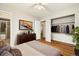 Bedroom with hardwood floors, a walk in closet, and neutral walls at 396 S Troy St, Aurora, CO 80012