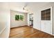 Sunny dining room with hardwood floors, a window, and a built-in cabinet at 396 S Troy St, Aurora, CO 80012