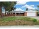 Charming brick home with a well-maintained front yard and attached garage at 396 S Troy St, Aurora, CO 80012