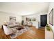 Inviting living room with hardwood floors and neutral colors, great for entertaining guests at 396 S Troy St, Aurora, CO 80012