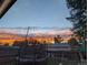 Sunset view over backyard with trampoline and play structures at 9581 Green Ct, Westminster, CO 80031