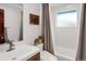 Clean bathroom with bathtub, shower, and updated vanity at 9581 Green Ct, Westminster, CO 80031