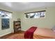 Spacious bedroom featuring a large window and book shelf at 9581 Green Ct, Westminster, CO 80031