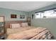 Relaxing main bedroom with plush bedding and window at 9581 Green Ct, Westminster, CO 80031