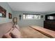 Main bedroom with large bed, window, and dark dresser at 9581 Green Ct, Westminster, CO 80031