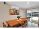 Bright dining area with wood table and access to backyard at 9581 Green Ct, Westminster, CO 80031