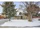 Ranch style home with a snow covered yard and mature trees at 9581 Green Ct, Westminster, CO 80031