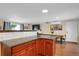 Eat-in kitchen with modern cabinetry and wood flooring at 9581 Green Ct, Westminster, CO 80031