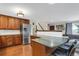 Modern kitchen with stainless steel appliances and wood cabinets at 9581 Green Ct, Westminster, CO 80031