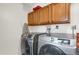 Laundry room with Samsung washer and dryer, plus cabinets at 9581 Green Ct, Westminster, CO 80031