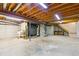 Unfinished basement with high ceilings and ample storage space at 8566 Flintwood Rd, Parker, CO 80138