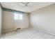 Simple bedroom with carpet, ceiling fan, and window at 8566 Flintwood Rd, Parker, CO 80138