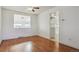 Dining area with hardwood floors and view to kitchen at 8566 Flintwood Rd, Parker, CO 80138