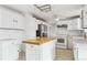 Kitchen with white cabinets and stainless steel appliances at 8566 Flintwood Rd, Parker, CO 80138