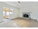 Living room with fireplace and access to sunroom at 8566 Flintwood Rd, Parker, CO 80138