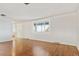 Bright living room with hardwood floors and large window at 8566 Flintwood Rd, Parker, CO 80138