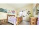 Bedroom with wood furniture, large window, and artwork on the walls at 10328 Bluffmont Dr, Lone Tree, CO 80124