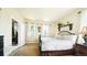 Bedroom with neutral walls, black metal bed frame, and natural light at 10328 Bluffmont Dr, Lone Tree, CO 80124