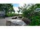 Scenic walking path with lush trees, landscaping, and sitting bench, perfect for relaxation and enjoying the outdoors at 10328 Bluffmont Dr, Lone Tree, CO 80124