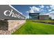 Exterior shot of Charles Schwab office building with modern architecture, green lawn, and prominent signage at 10328 Bluffmont Dr, Lone Tree, CO 80124