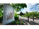 Entrance to Bluffmont Park featuring lush greenery and a tranquil walking path at 10328 Bluffmont Dr, Lone Tree, CO 80124