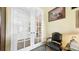 Elegant entryway with glass French doors and a decorative chair at 10328 Bluffmont Dr, Lone Tree, CO 80124
