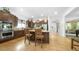 Modern kitchen features a large island, stainless steel appliances, and hardwood floors at 10328 Bluffmont Dr, Lone Tree, CO 80124