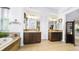 Elegant main bathroom with dual vanities, a soaking tub, and tiled floors at 10328 Bluffmont Dr, Lone Tree, CO 80124