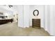 Bright and airy main bedroom with a decorative dresser and access to the ensuite bathroom at 10328 Bluffmont Dr, Lone Tree, CO 80124