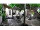 Charming outdoor patio with pergola, elegant seating, and beautiful landscaping at 10328 Bluffmont Dr, Lone Tree, CO 80124