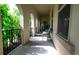 Covered porch featuring arched columns and outdoor seating, perfect for relaxation at 10328 Bluffmont Dr, Lone Tree, CO 80124