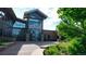 Modern recreation center featuring a glass facade, stone accents, and well-maintained landscaping at 10328 Bluffmont Dr, Lone Tree, CO 80124