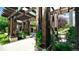 Inviting walkway with wooden pergola and climbing flowers offering a tranquil community space at 10328 Bluffmont Dr, Lone Tree, CO 80124