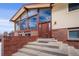 Front entrance with brick steps leading to a wooden door at 2780 Juniper Dr, Golden, CO 80401