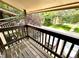 Balcony featuring wooded flooring, wooden railing, and views of the exterior at 1870 S Pitkin Cir # B, Aurora, CO 80017