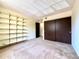 Spacious bedroom featuring built-in shelving and a closet with sliding doors at 1870 S Pitkin Cir # B, Aurora, CO 80017