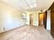 Bedroom with view into adjoining bathroom and laundry areas, featuring neutral carpet at 1870 S Pitkin Cir # B, Aurora, CO 80017