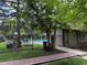 The neighborhood pool area has black metal fencing and large shade trees at 1870 S Pitkin Cir # B, Aurora, CO 80017