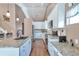 Kitchen featuring granite countertops, stainless appliances, and white cabinetry at 479 W Jamison Cir, Littleton, CO 80120